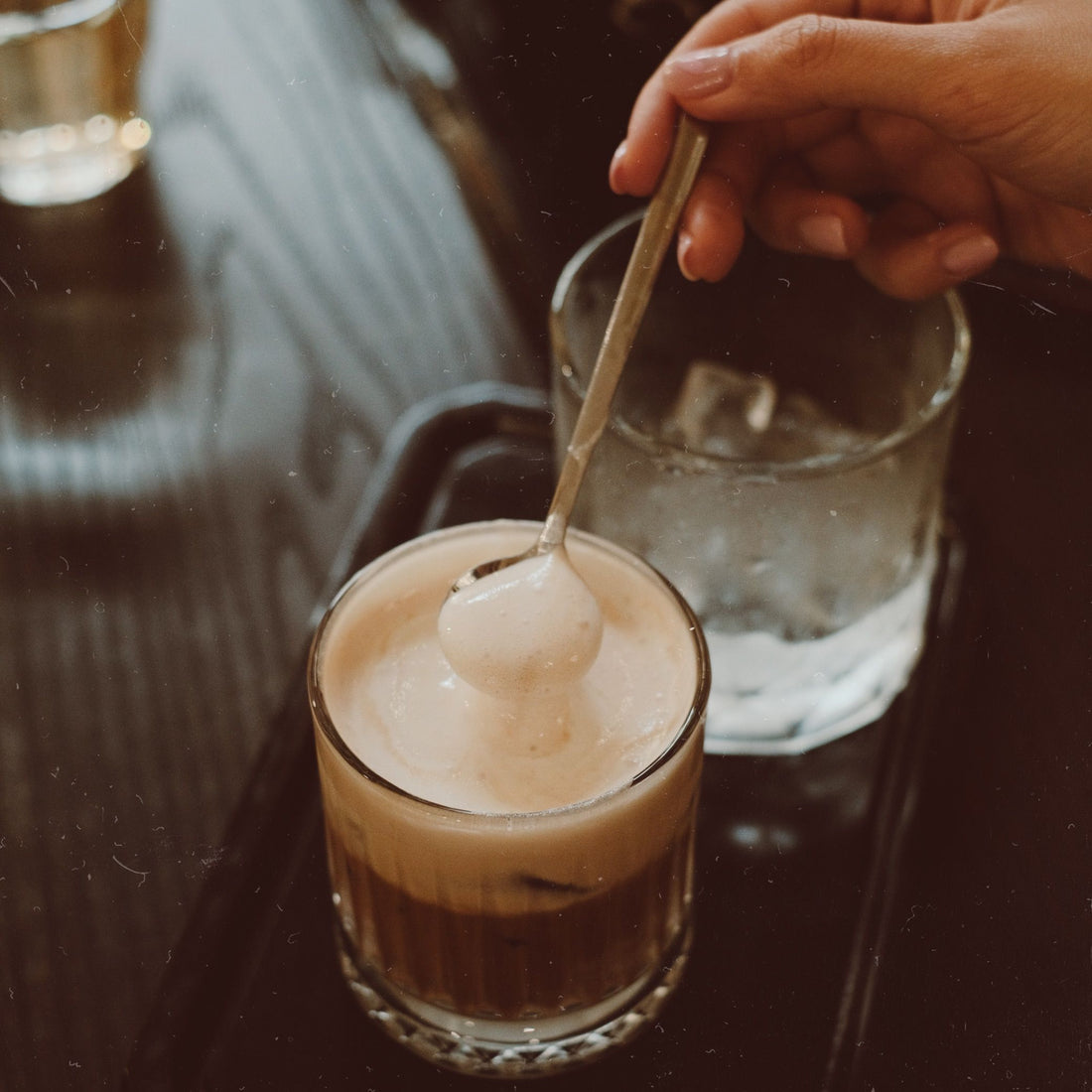 Coffee and ice cream in a glass with a spoon